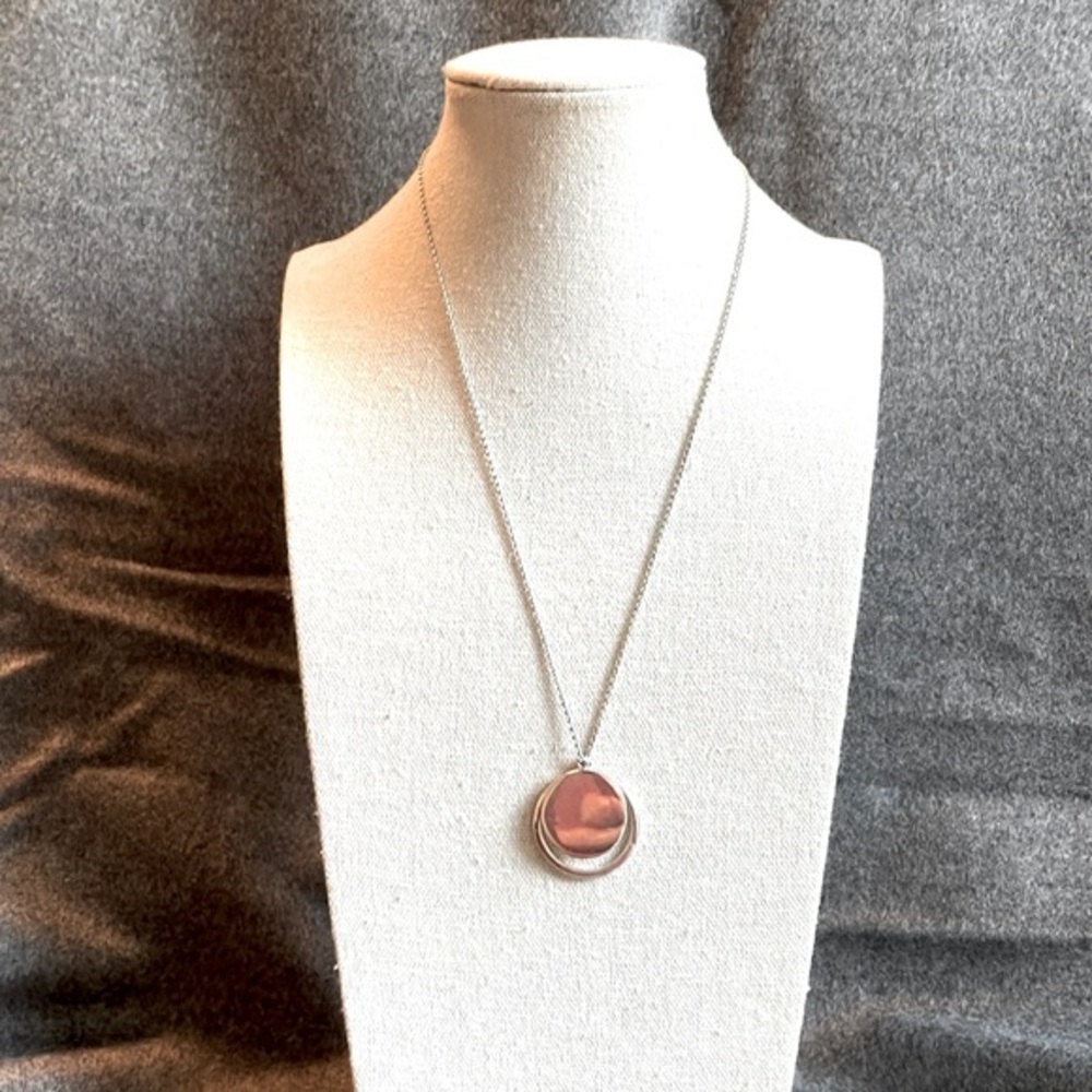 Gorgeous sterling silver necklace with circle and nesting ring. Timeless.